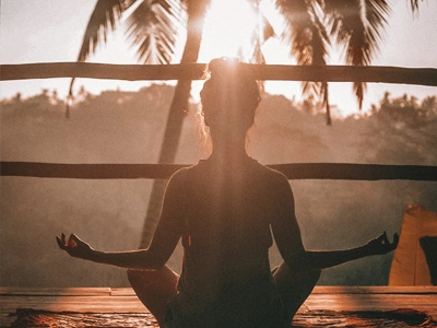 Someone meditating outdoors