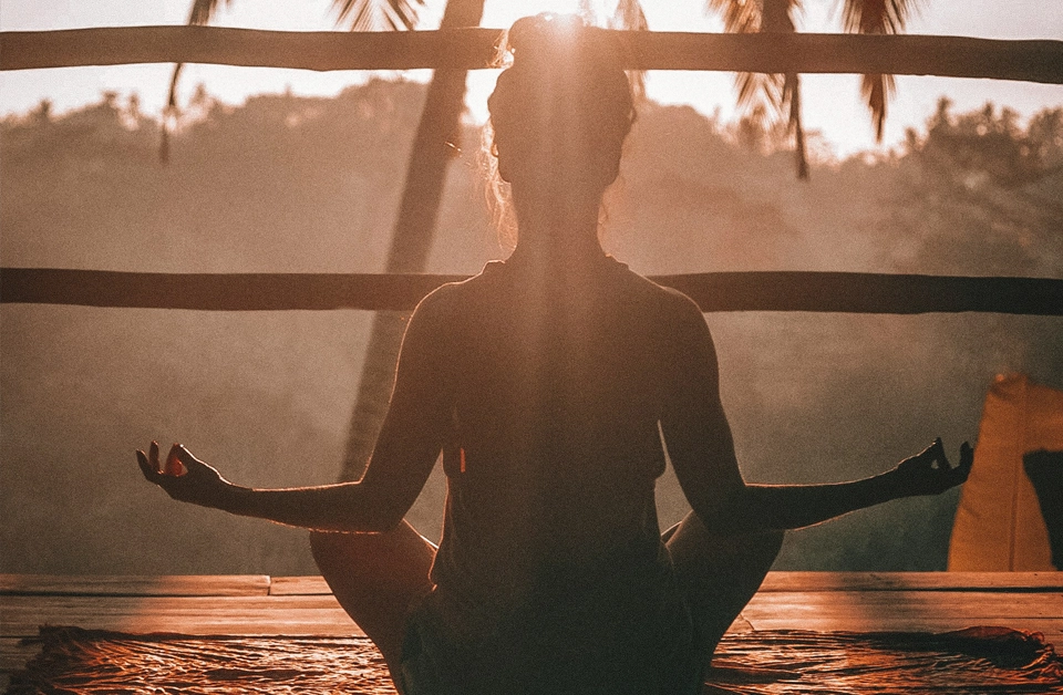 Someone meditating outdoors