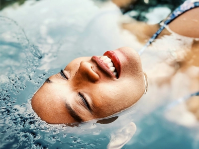Someone laying in a pool of water with fresh skin.